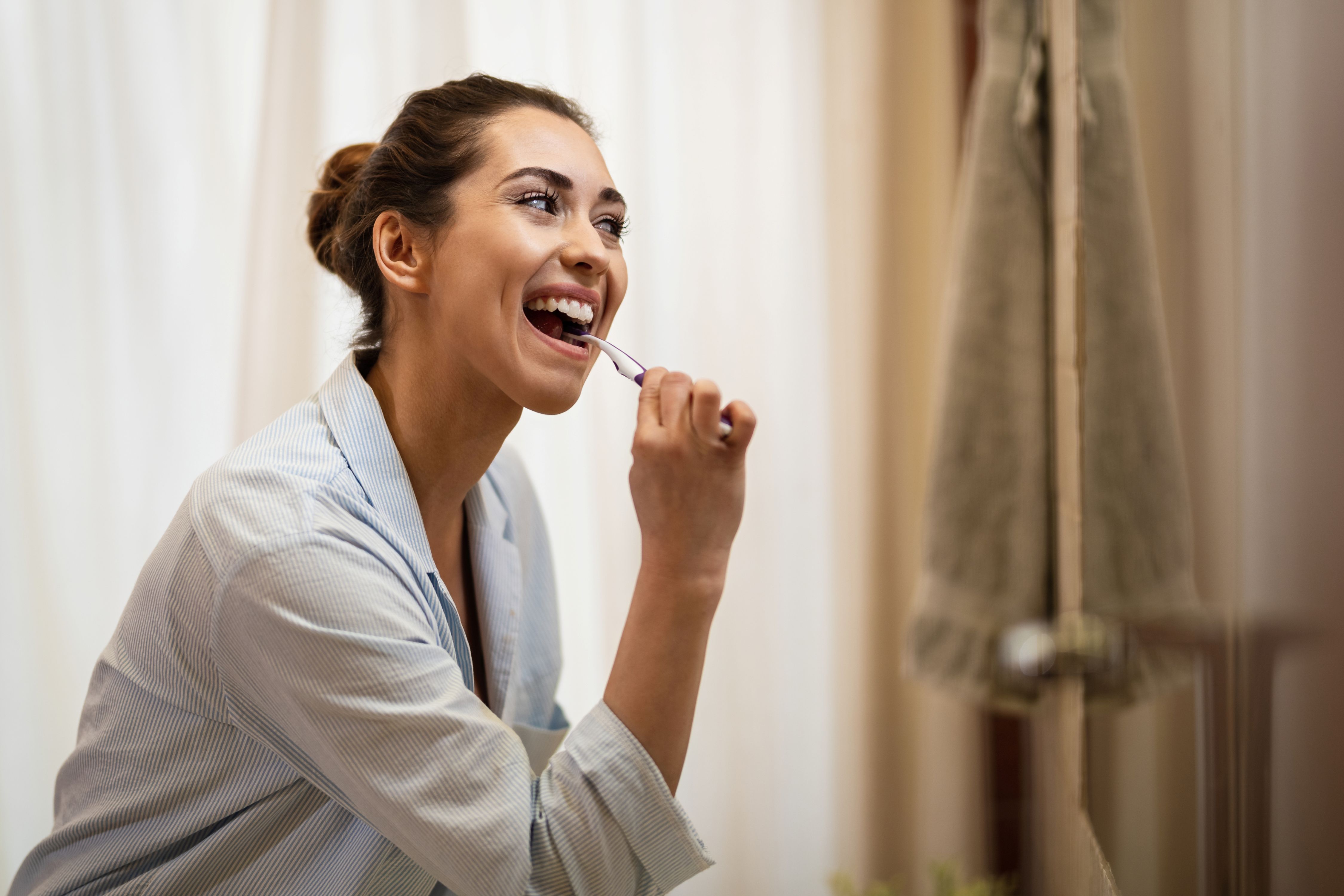 Dental hygienist cleaning teeth
